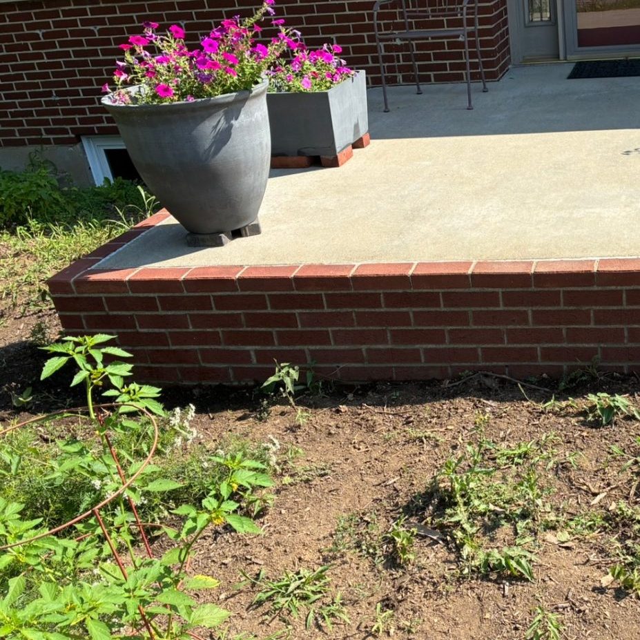 Same porch after pressure washing — clean concrete